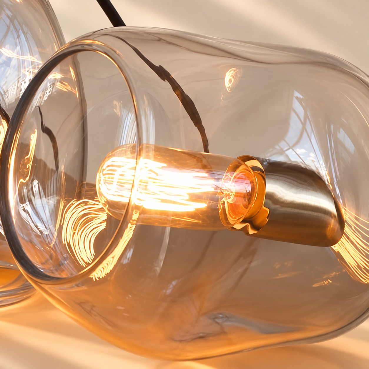 Organic glass pendant shade glowing softly