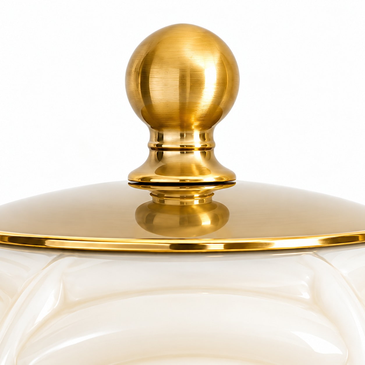 Brass ball top and fitted cap above the cream glass shade