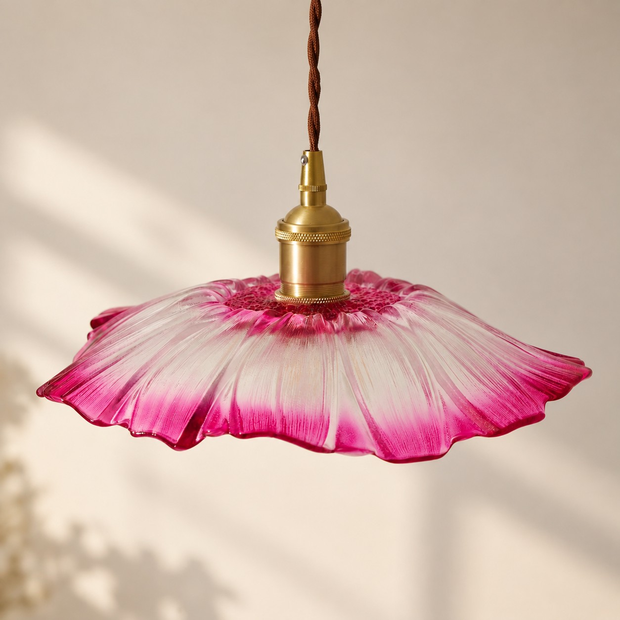 Close-up of ribbed flower glass shade and copper socket