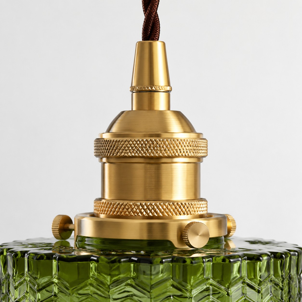 Close-up of the complete brushed brass lamp holder and knurled adjustment rings