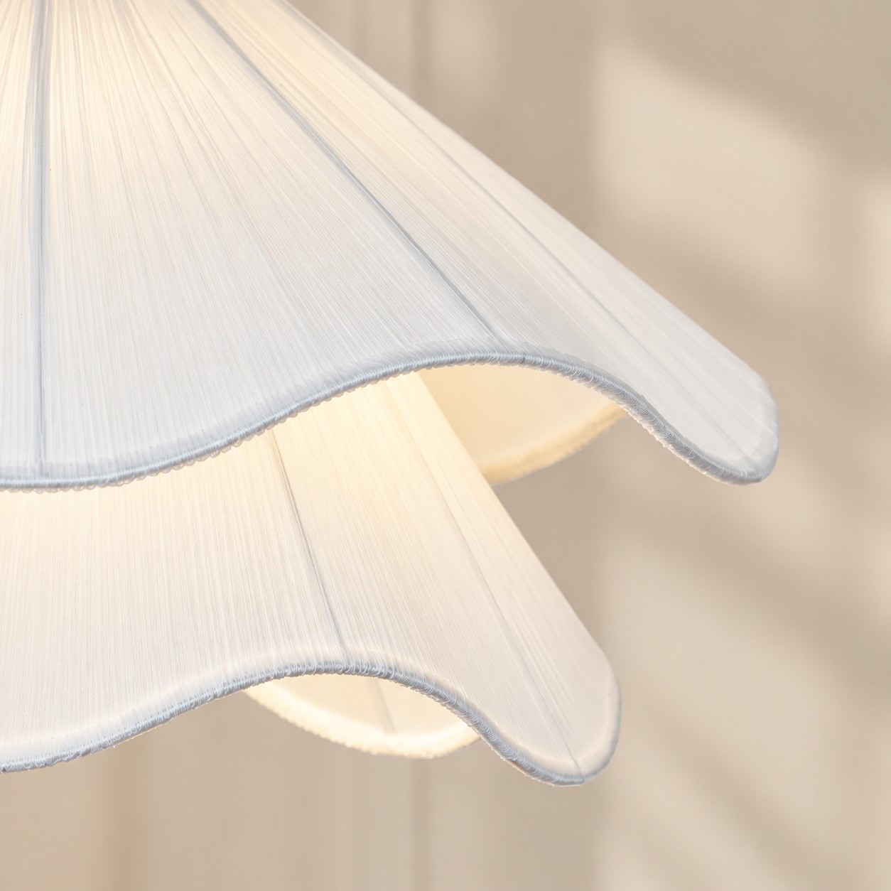 Close-up of layered pleated white fabric shade