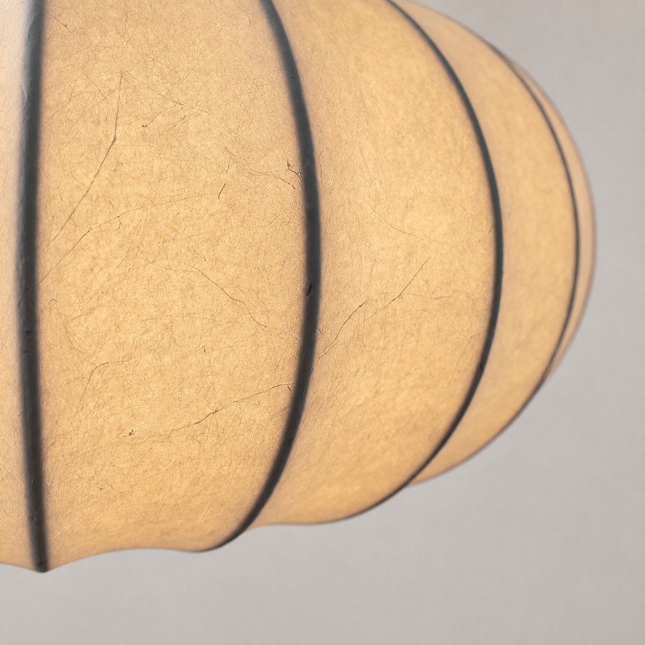 Close-up of the pendant light's textured translucent shade