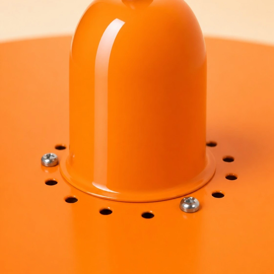 Close view of the orange centre cap, ventilation holes and fasteners