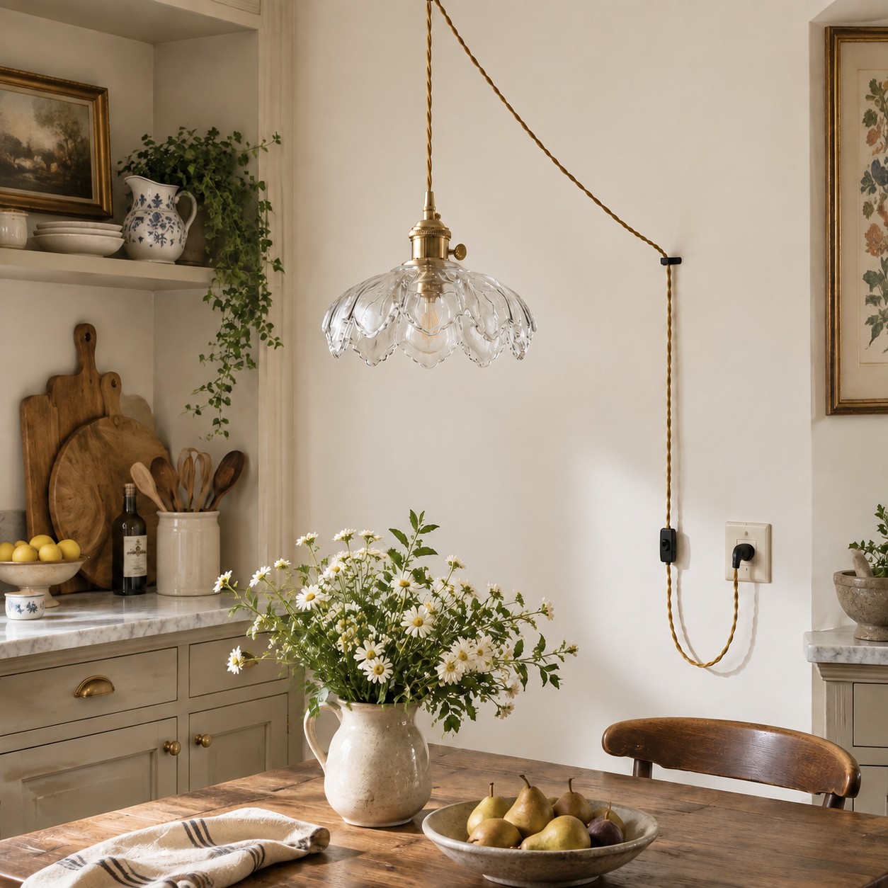 Clear flower glass pendant above a dining table