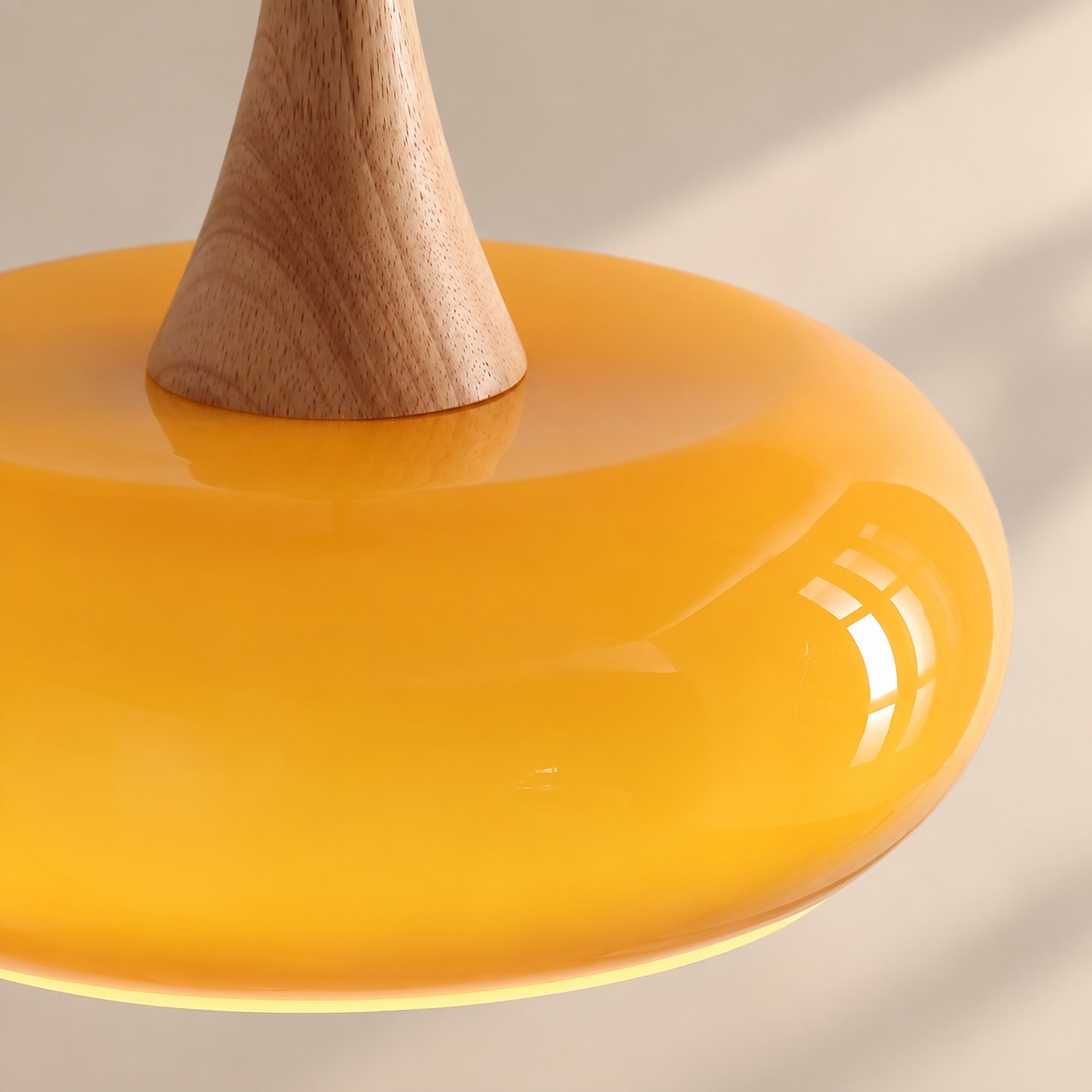 Close-up of wood neck meeting glass shade