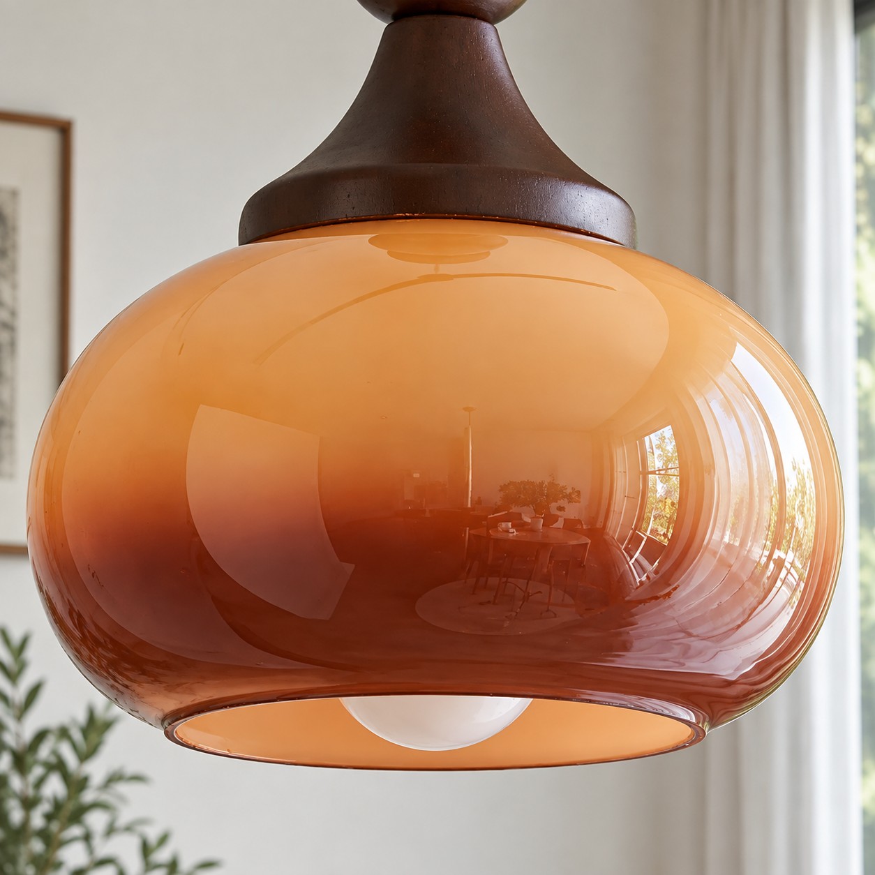 Close-up of brown glass shade and E26 socket