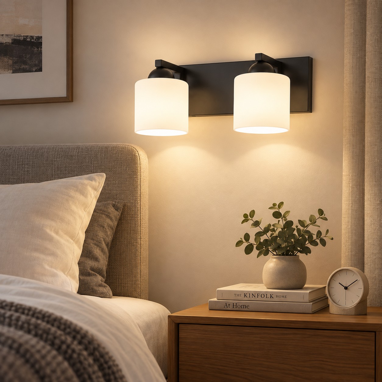 Two-light opal glass wall fixture beside a bed